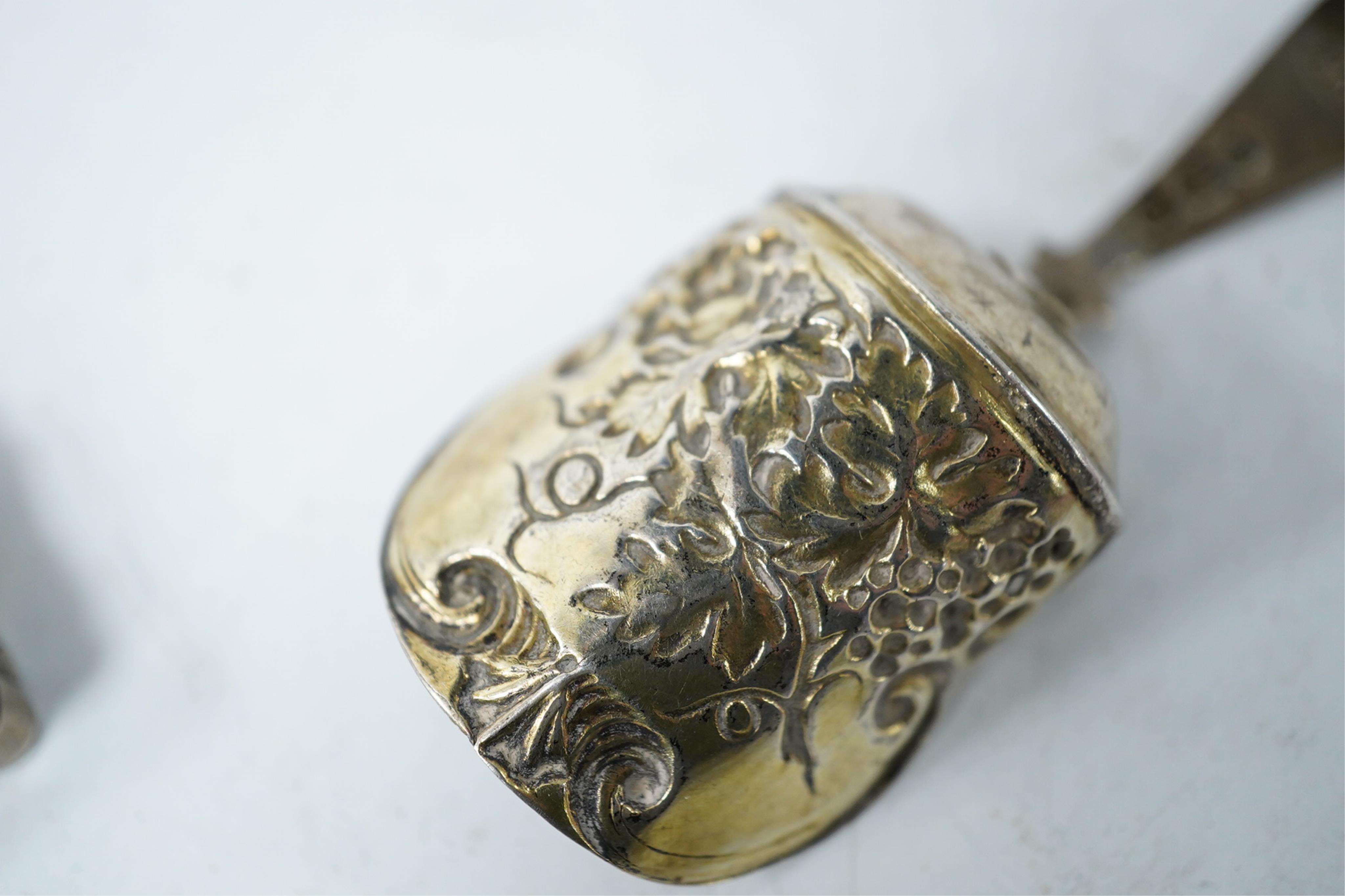 A Victorian silver shaped rectangular vinaigrette, engraved with a scene to commemorate The Great Exhibition at the Crystal Palace in Hyde Park, London, by William Dudley, Birmingham, 1850, 33mm, together with three smal
